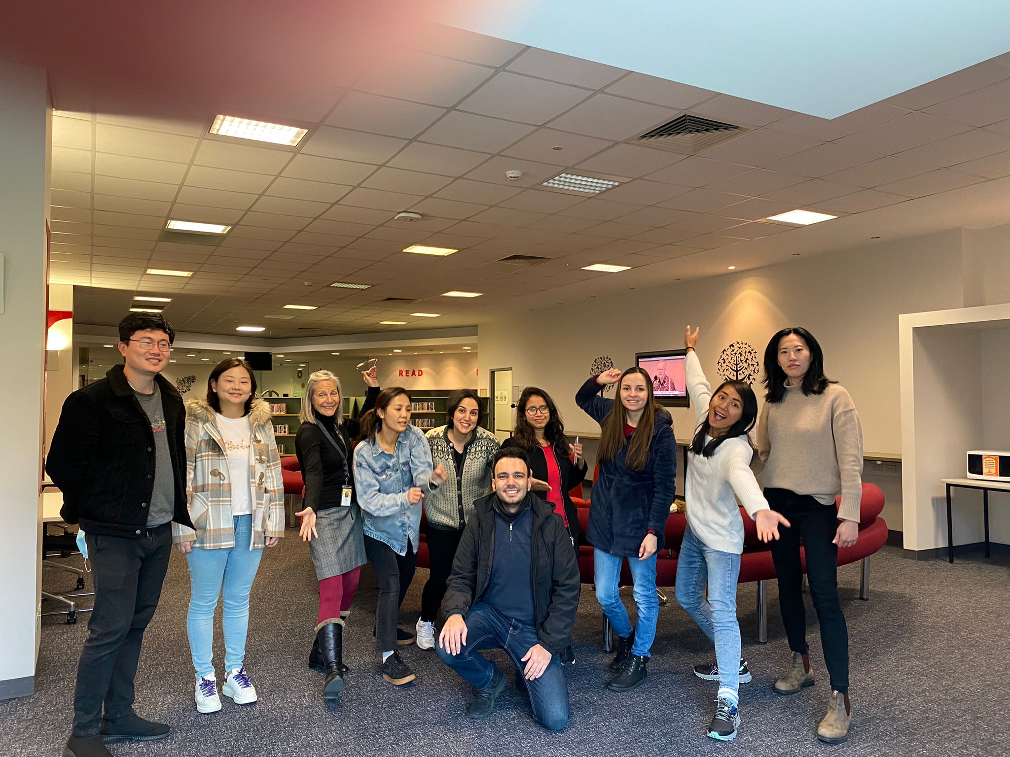 AMEP Workin it out students pose for a photo in the Library