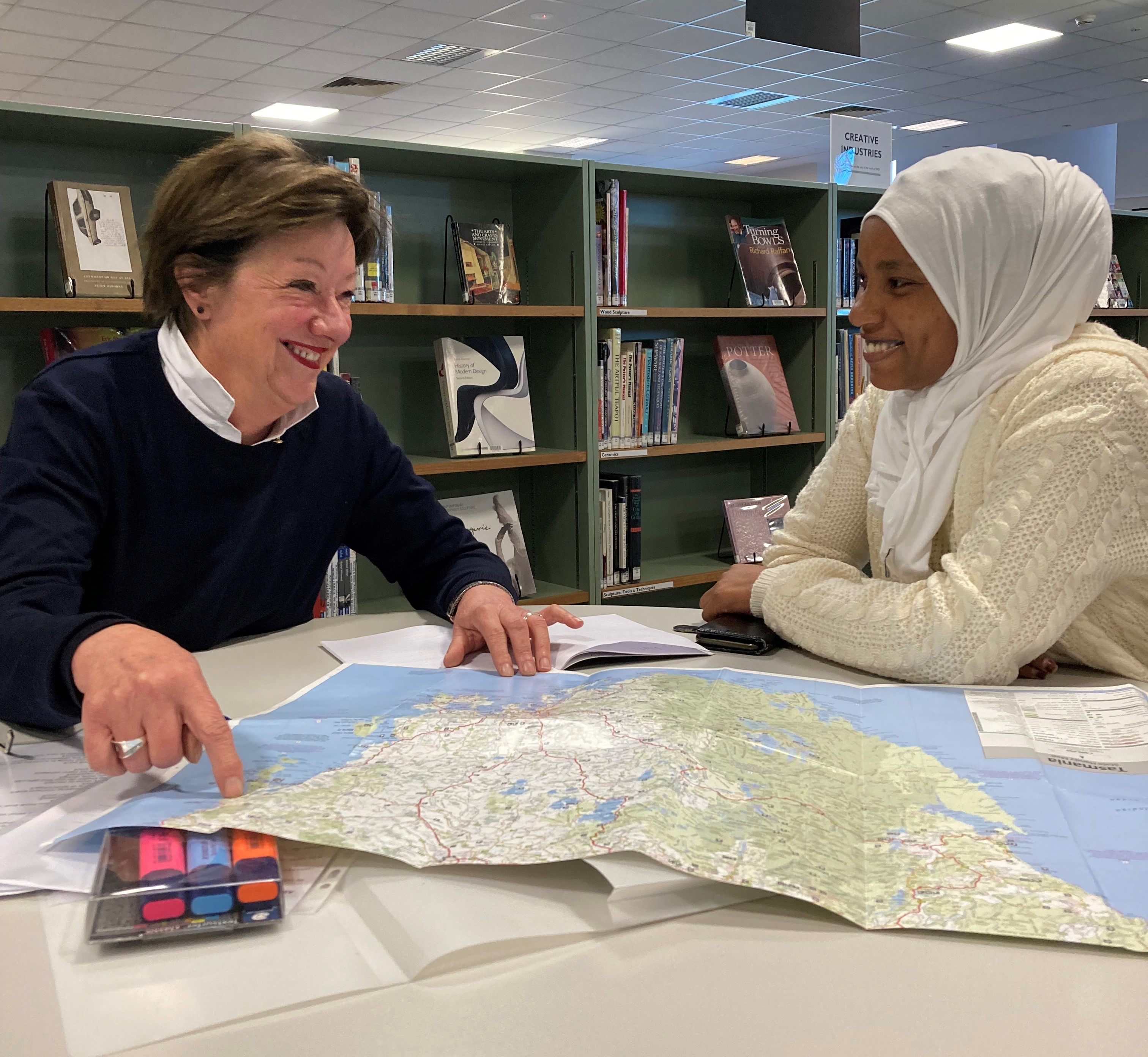 AMEP Teacher with a student looking at a map